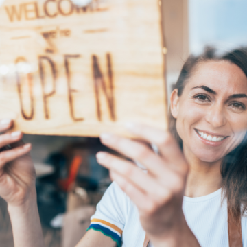 Woman with open sign