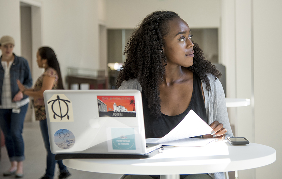 Student studying on their laptop